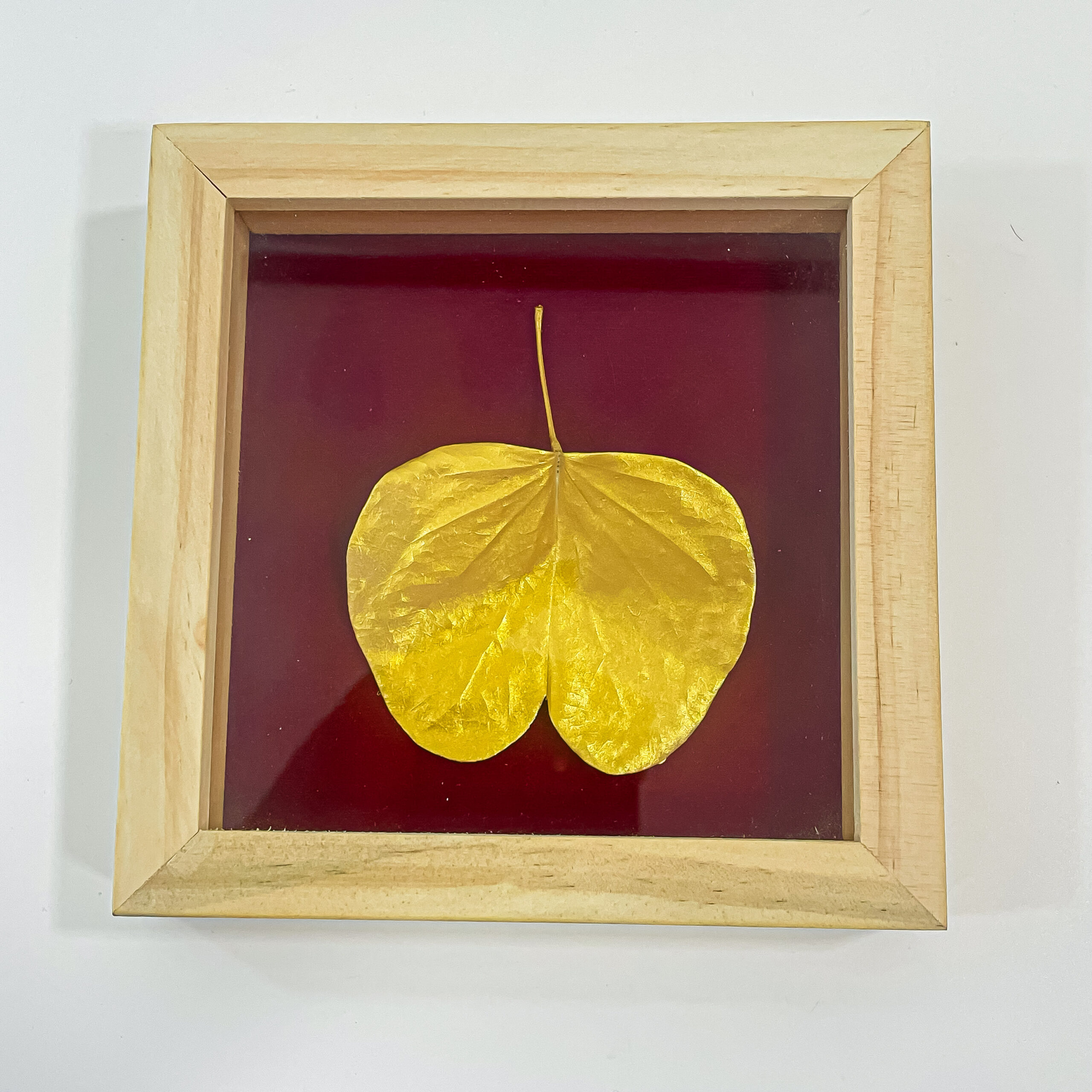 Golden palm leaf photo frame