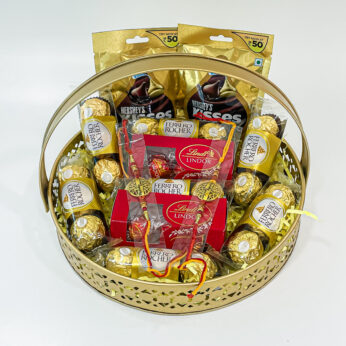 Chocolicious Bliss: Raksha Bandhan Gift Hampers with Ferrero Rocher, Hershey’s Kisses, Lindt Swiss Mil, Premium Rakhis, and Greeting Card