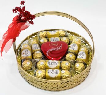 Radiant Wishes With Happy New Year Gift for Her – Lindt Lindor, Ferrero Rocher, and Delicate Blooms in a Brass Basket