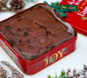 Indulge in Festive Delight with Our Christmas Cake in a Charming Red Metal Box