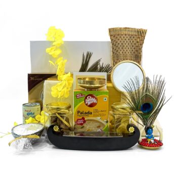 Special Vishu gift hamper embellished with Kasavu saree, Valkannadi, Kanikonna, and more