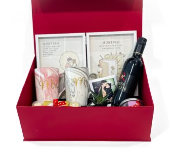 The Ultimate Anniversary Gift Box with Mr and Mrs Mugs, Book Photo Frame, Ferrero Rocher, Red Noon, Scented Candle, Plant and Pot, and Greeting Card