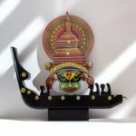 kathakali face with 3 man boat